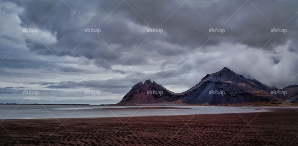 Mountains against cloudy sky