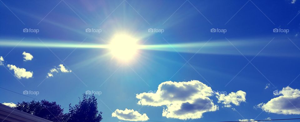 Beautiful sun in the sky. the view from my backyard 💜