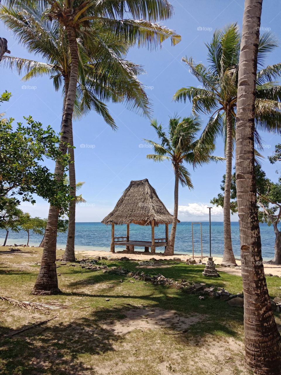 Hut by the beach on a sunny day. Com,  Lautem,  Timor-Leste.