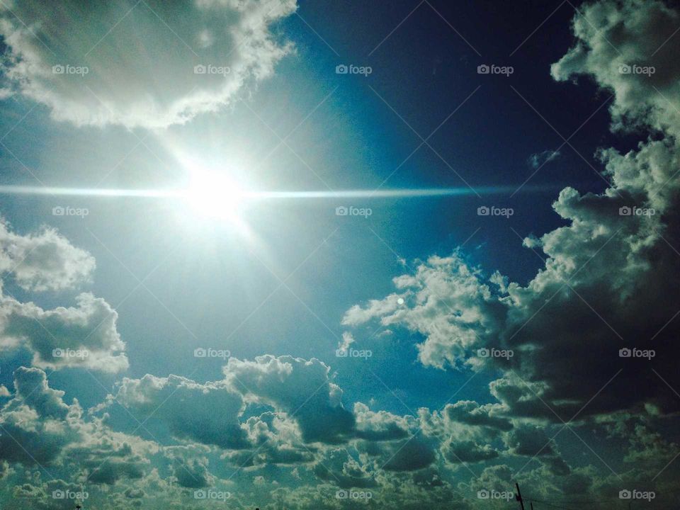 cloudy sky with sun glare