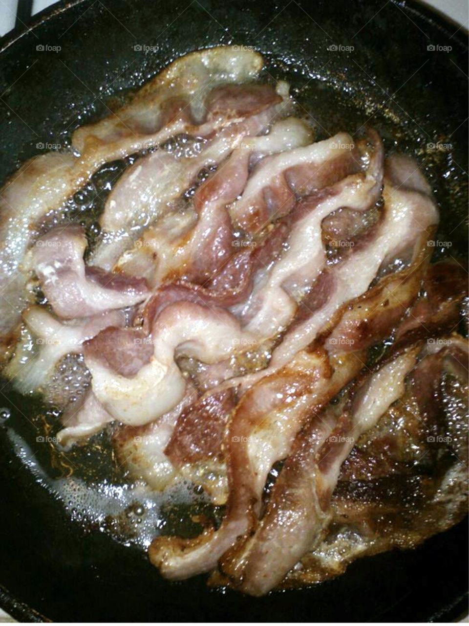 Bacon frying on pan