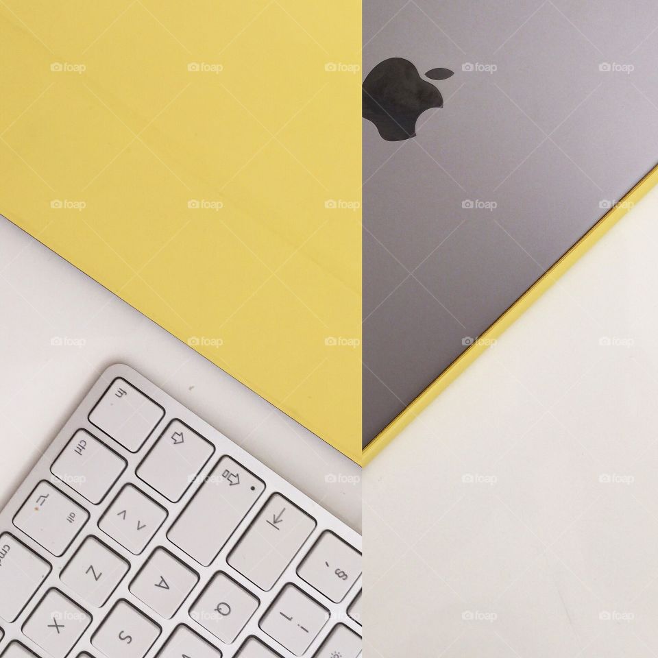 Think different . A composition of a space grey iPad and the very unusual yellow iPad smart cover. 