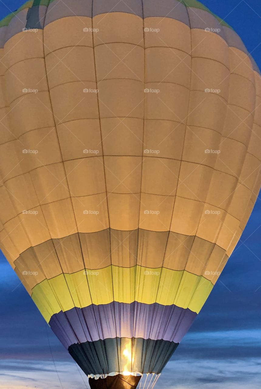 Hot air ballon lit up at dusk