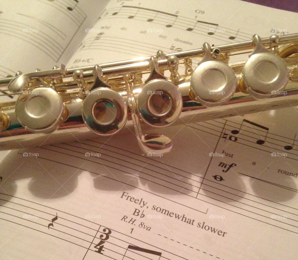Flute and Music. flute over sheet music 