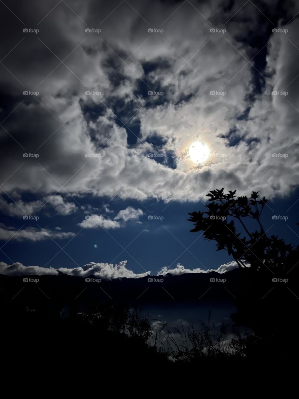 Moonlight through the clouds