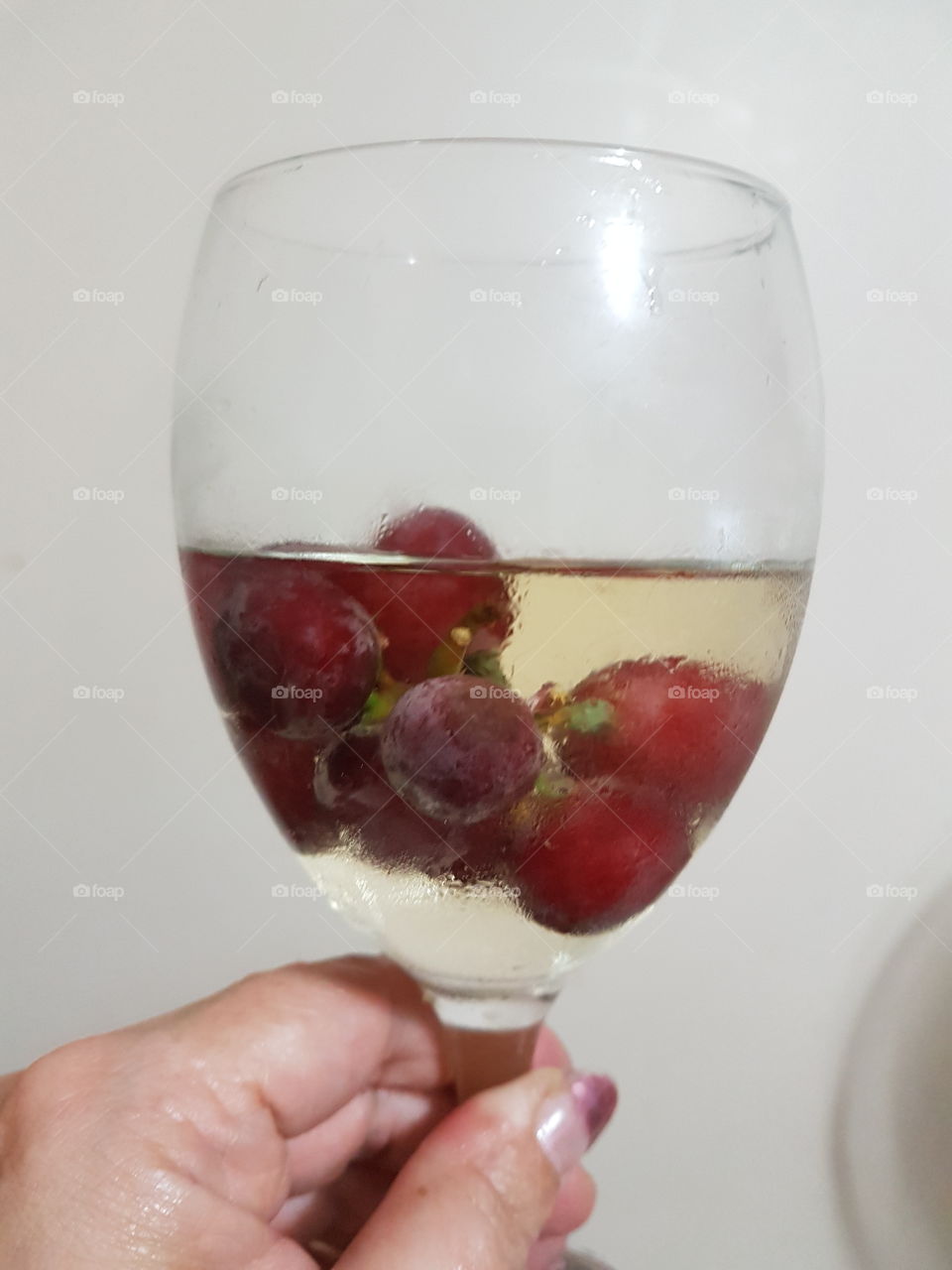 cooling wine with frozen grapes