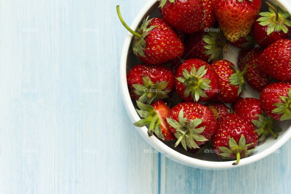 Strawberry close-up view. On white dish