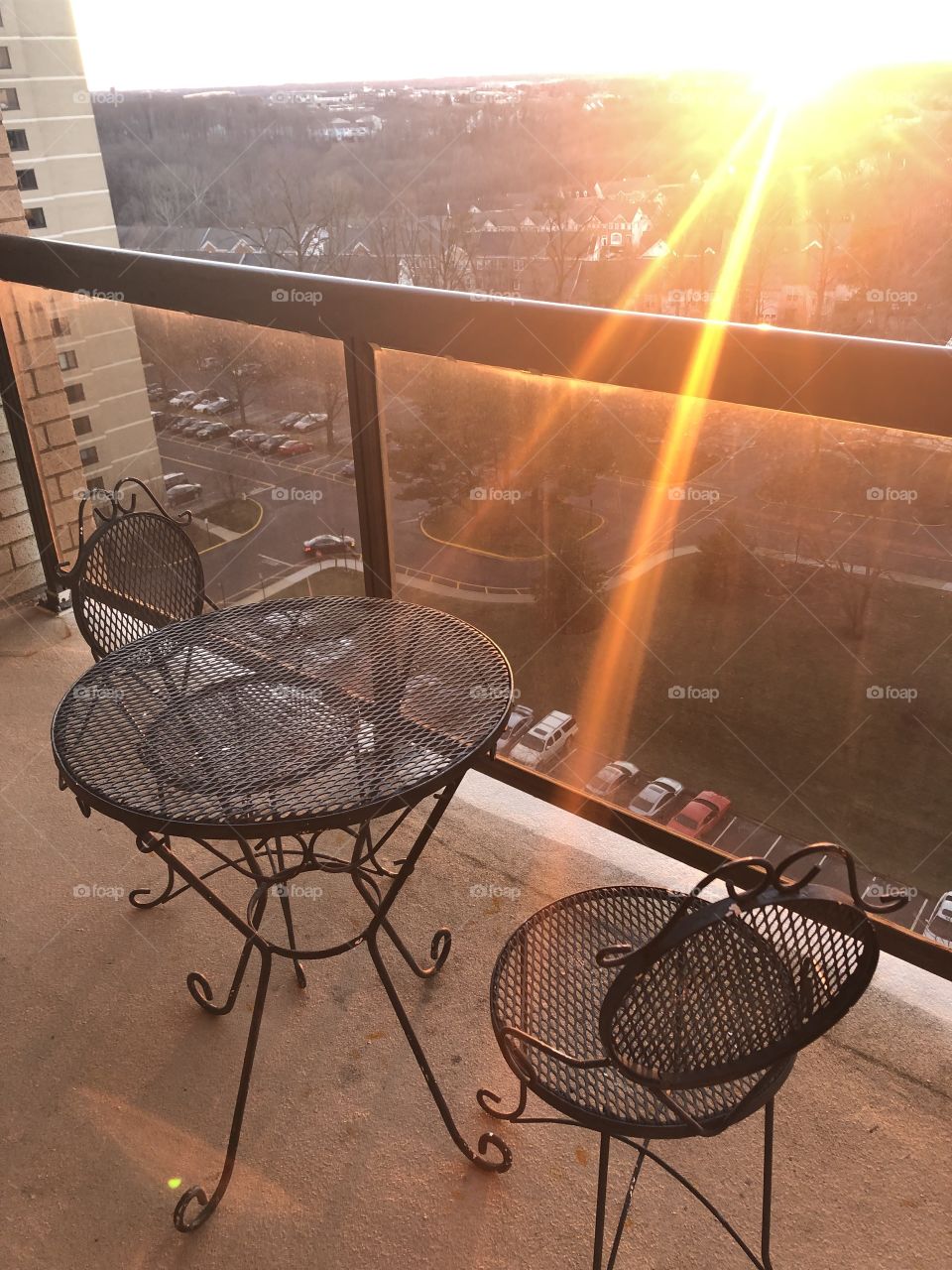 Table for two on the balcony with a sunset please.