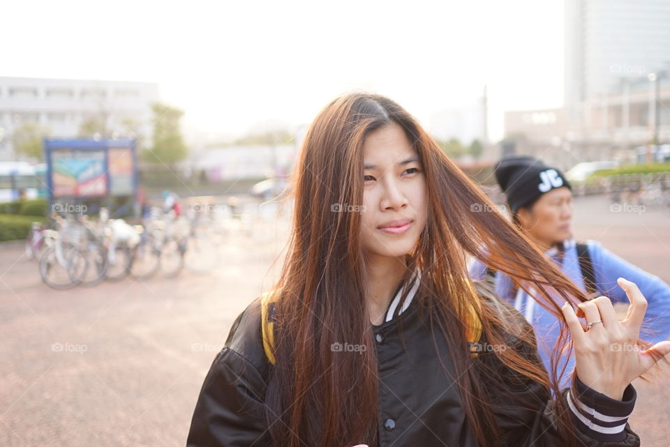 Cute Japanese teenager in baseball jacket