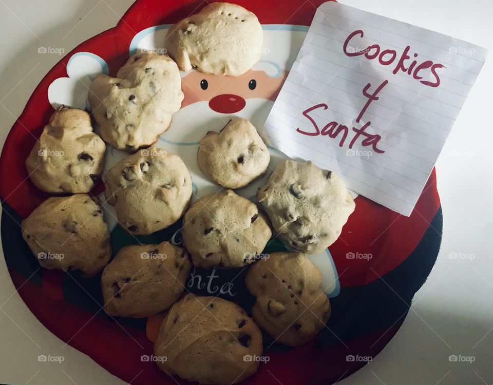 Cookies for Santa, Delicious chocolate chip cookies displayed on a Santa Clause Christmas plate. 