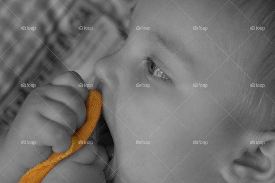 b&w baby with orange cloth