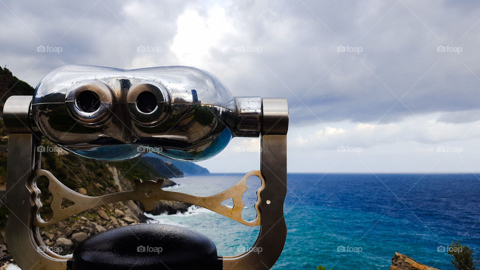 Binoculars and seascape in Vernazza in Italy
