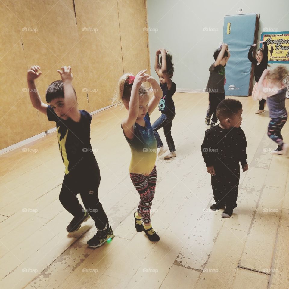 Children doing pirouette at dance class