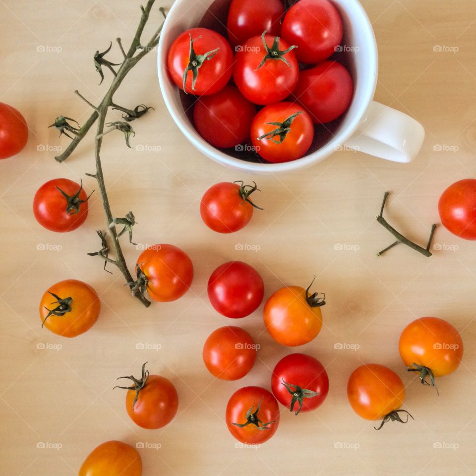Fresh organic cherry tomatoes on table