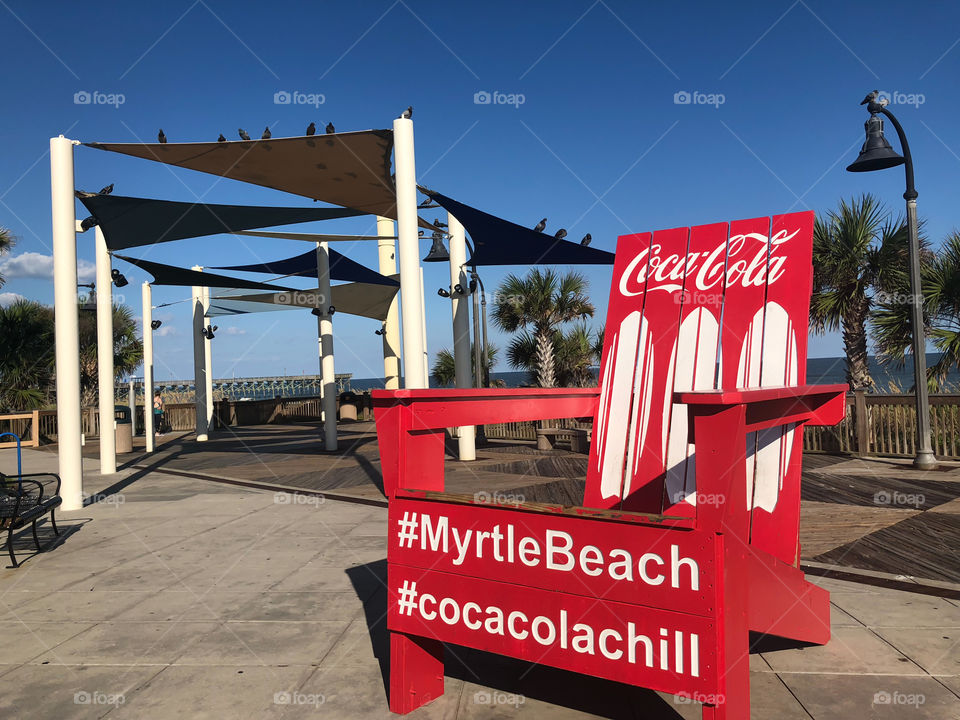A large red Adirondack promoting Myrtle Beach South Carolina and Coca Cola in Pavilion Park. 