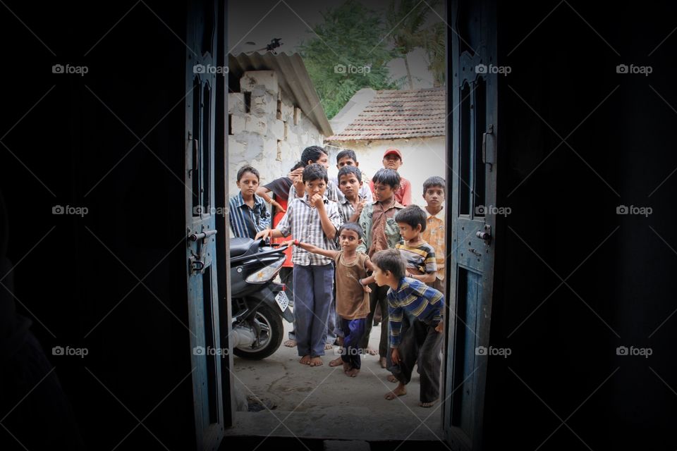 Group of children standing outside the door