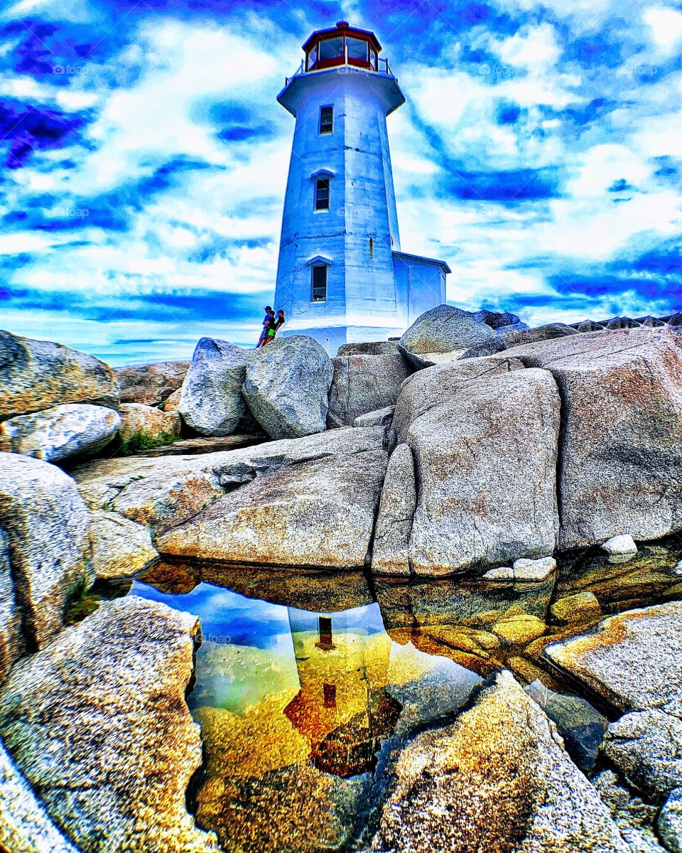 Beautiful Peggy’s Cove lighthouse in Nova Scotia Canada on a summer day. 