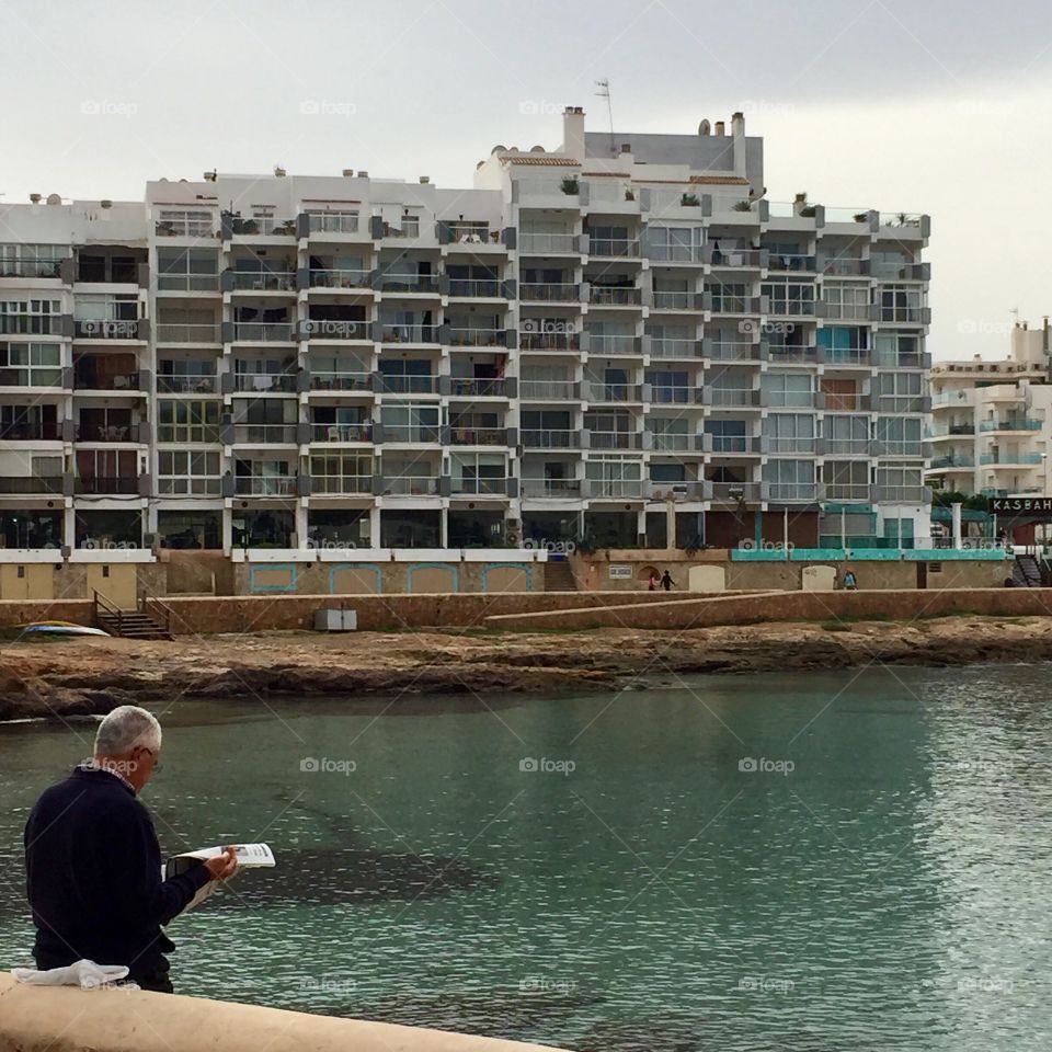 Elderly man reading newspapers 