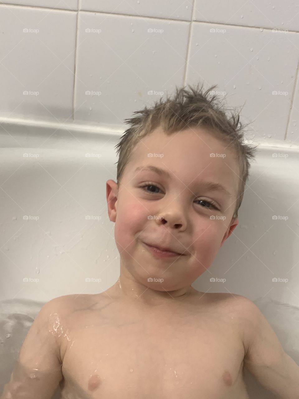 Boy loves bath time 