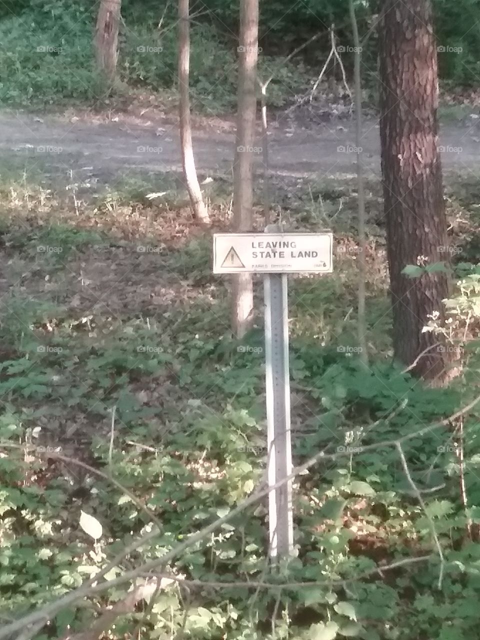 Sign, leaving state land