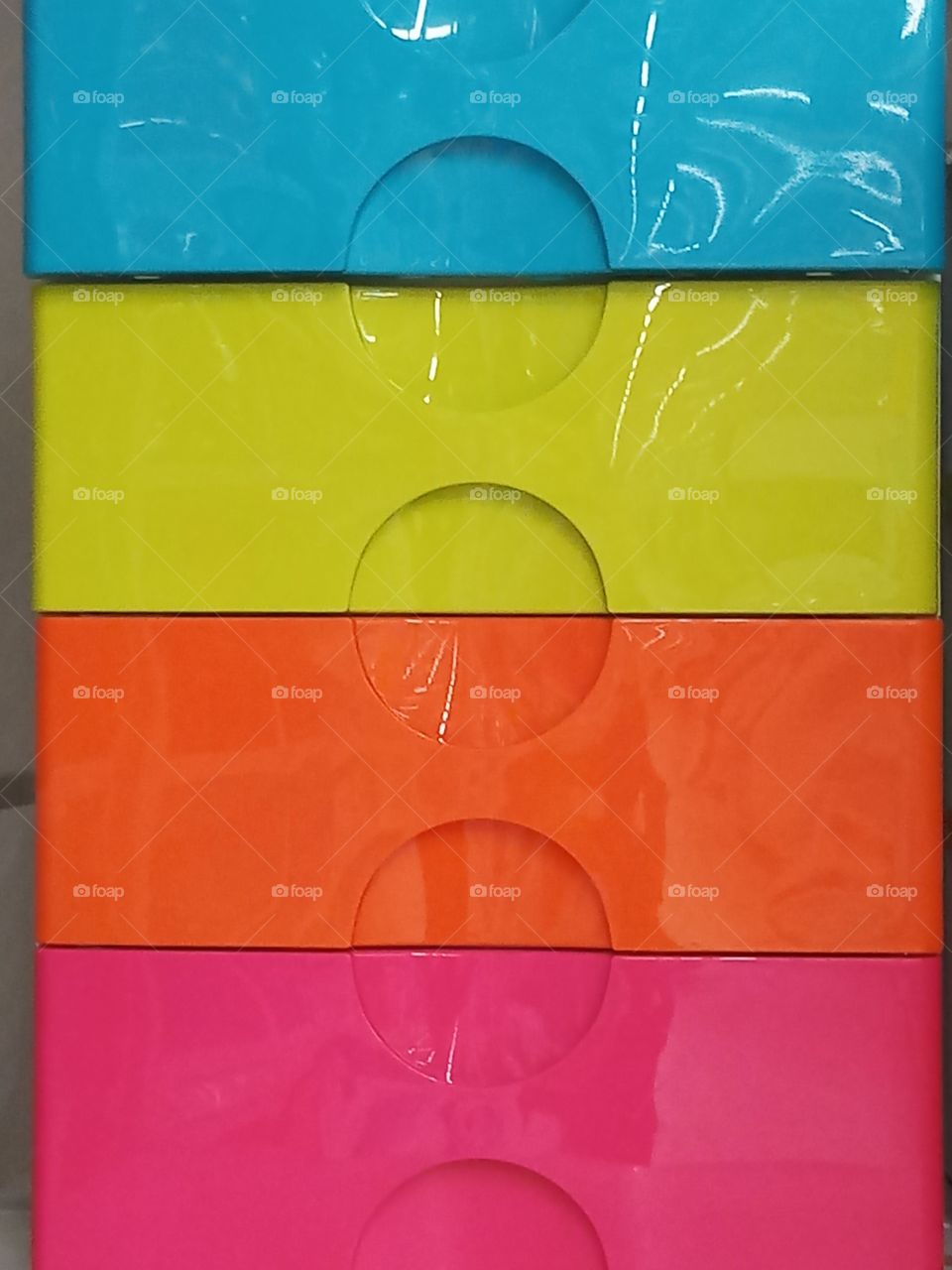 colorful plastic boxes in vertical layers