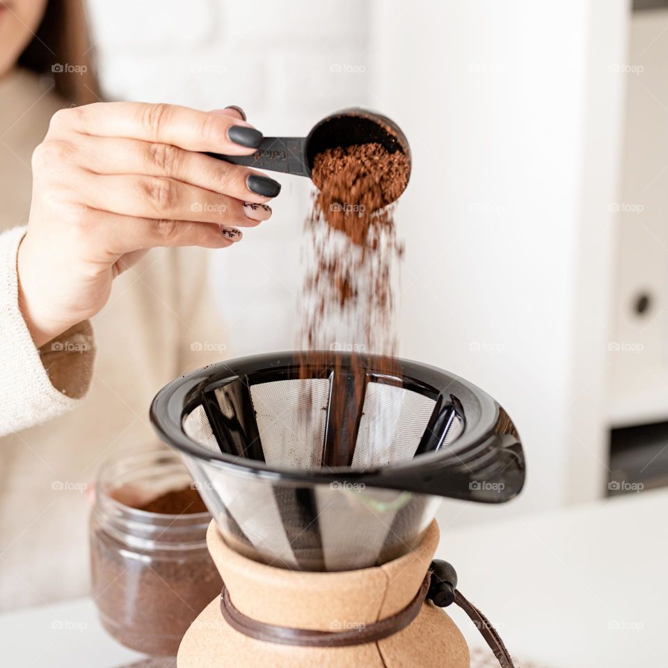 woman brewing coffee