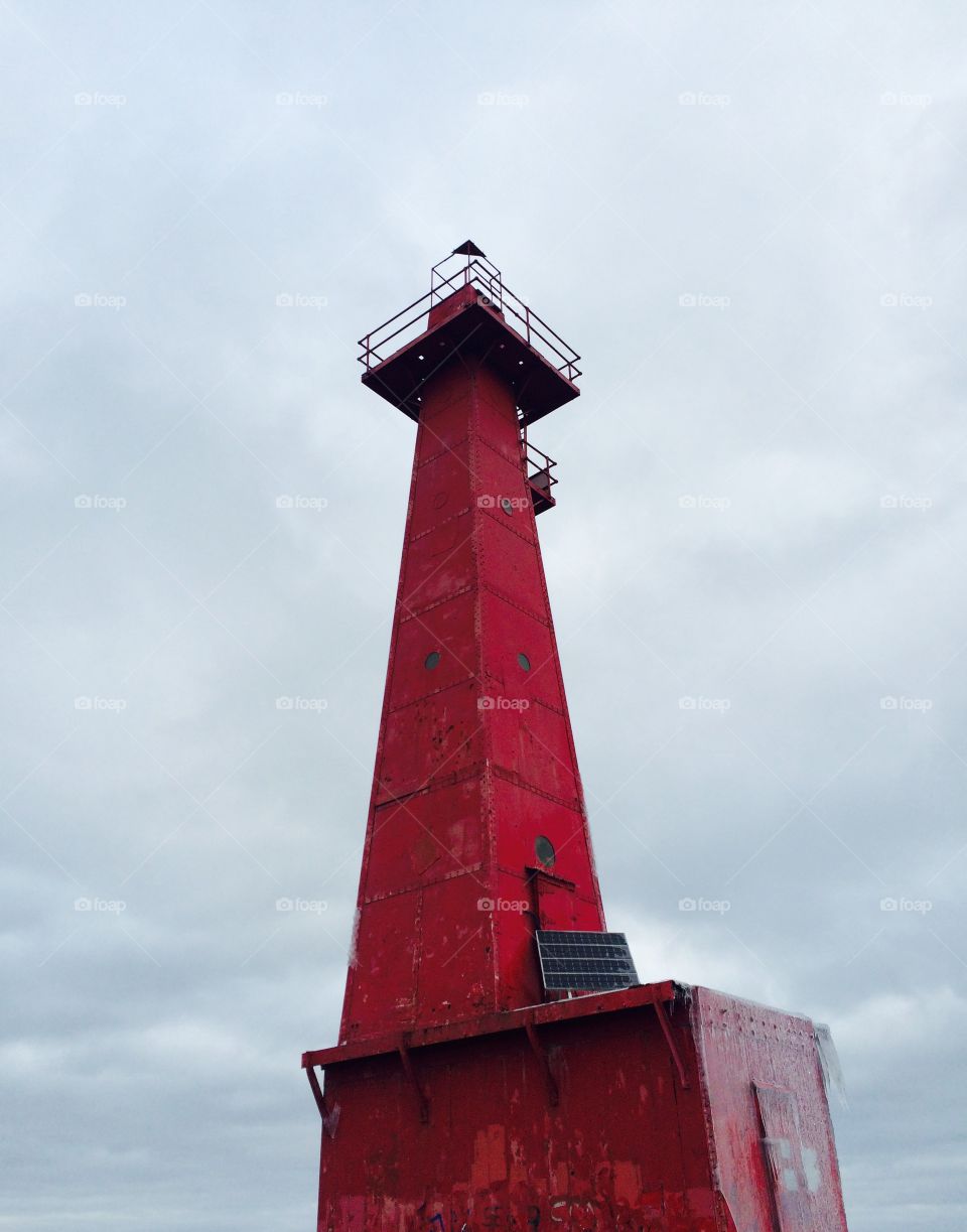 View of lighthouse against cloud sky