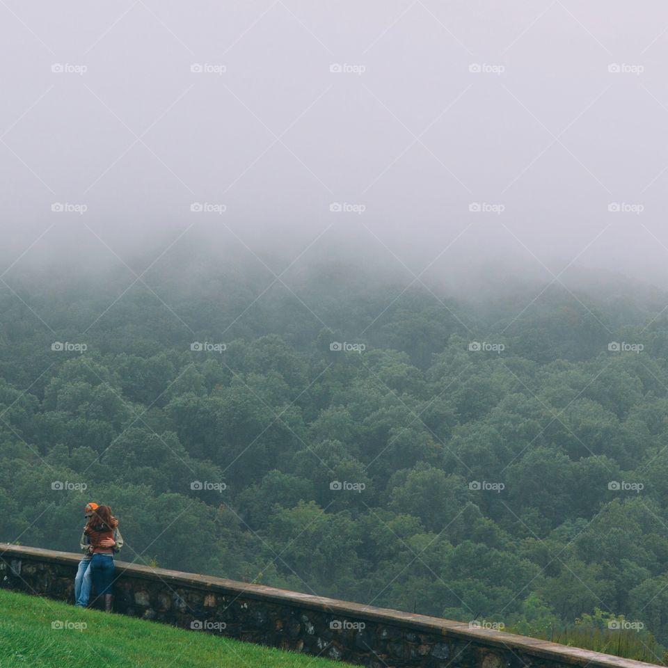 Couple enjoying the fog in early Autumn