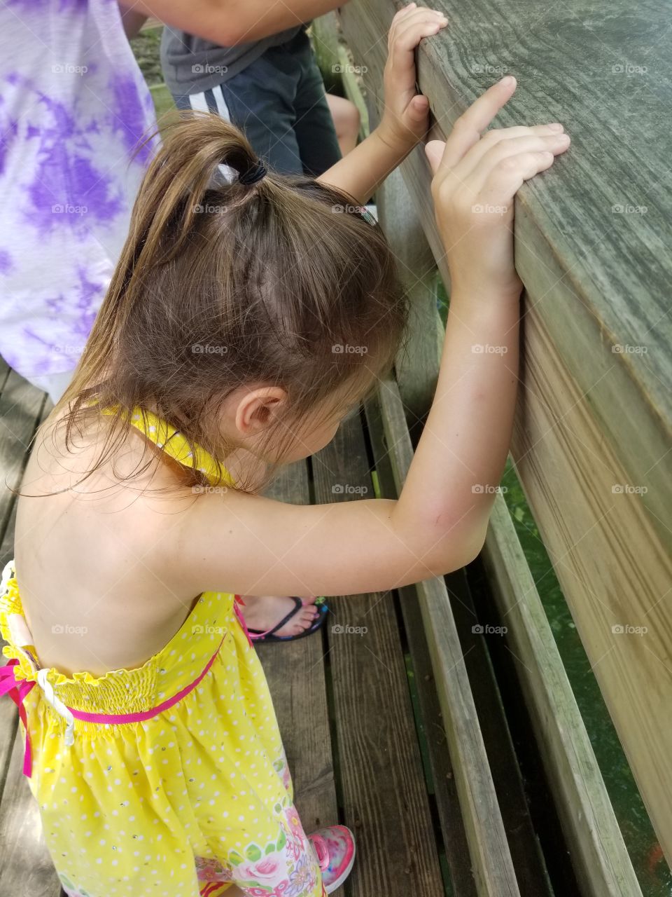 child on deck in summer