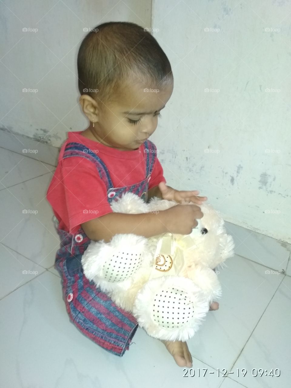 playing with teddy bear