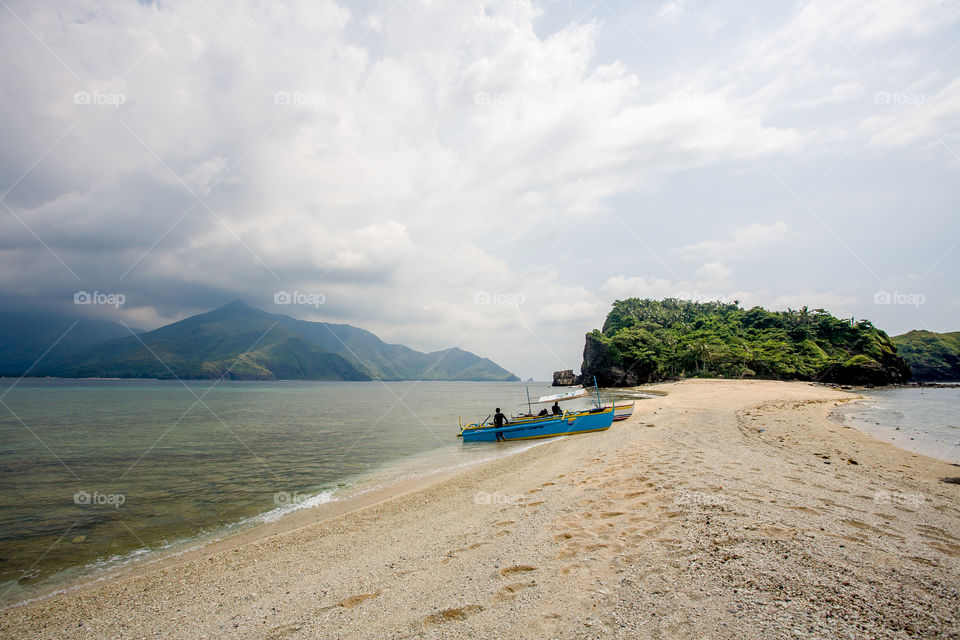 Boat moored on beach