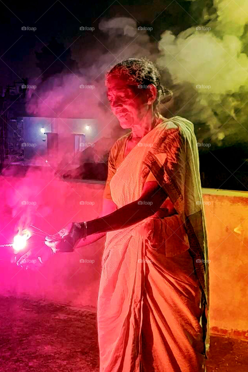 My mother is also became a child and enjoyed Deevali with sparkles.