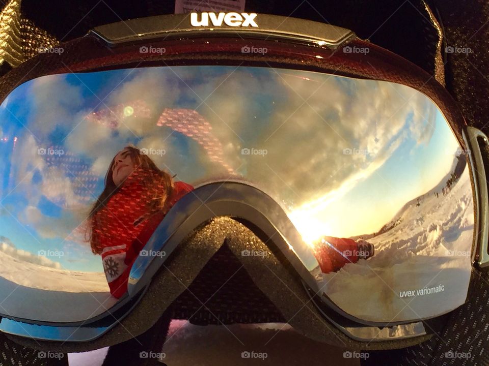 Woman reflecting on goggles