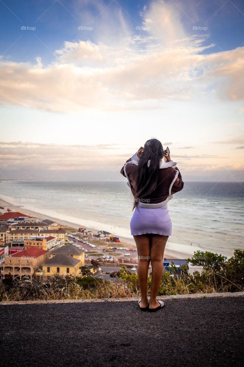 lady standing overseeing ocean view