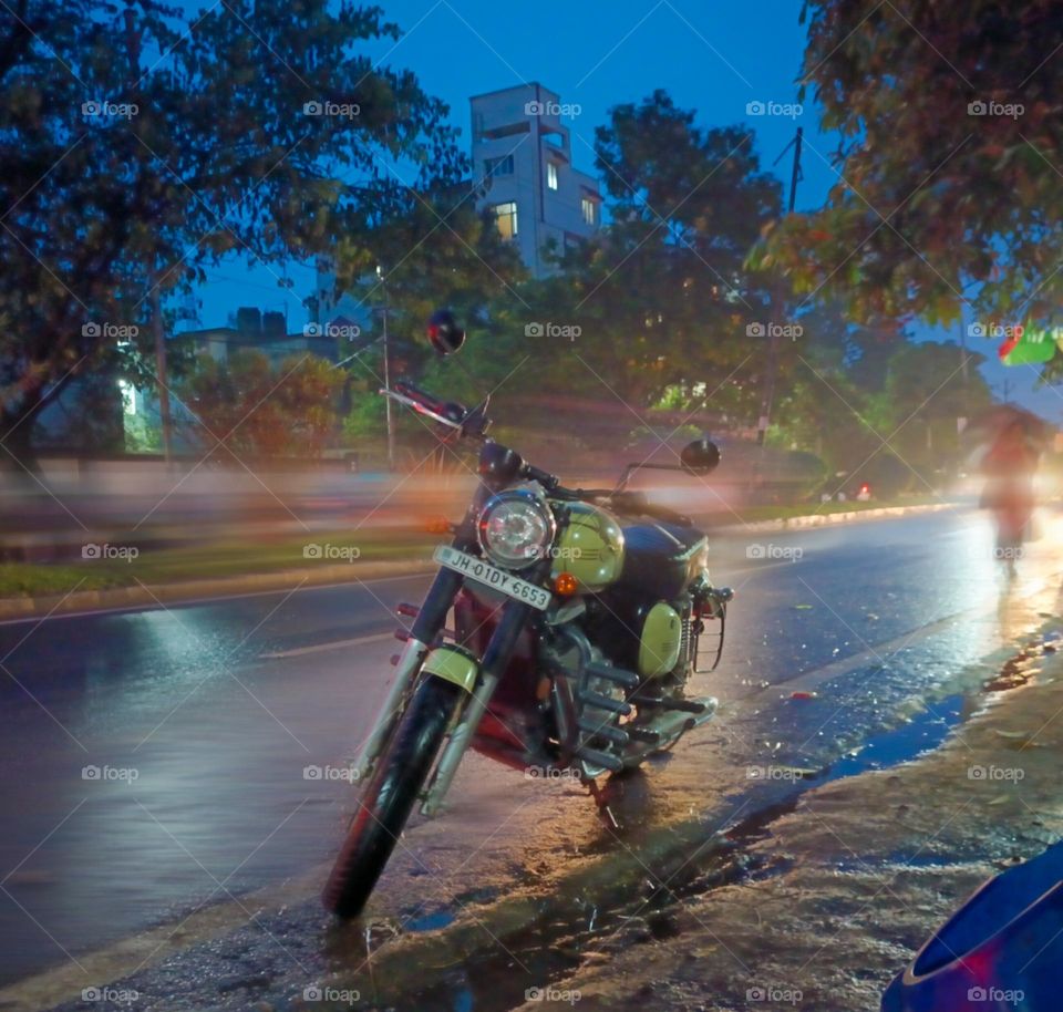 bike ride in rain makes u feel alive . real love colour blue blur mobile shot