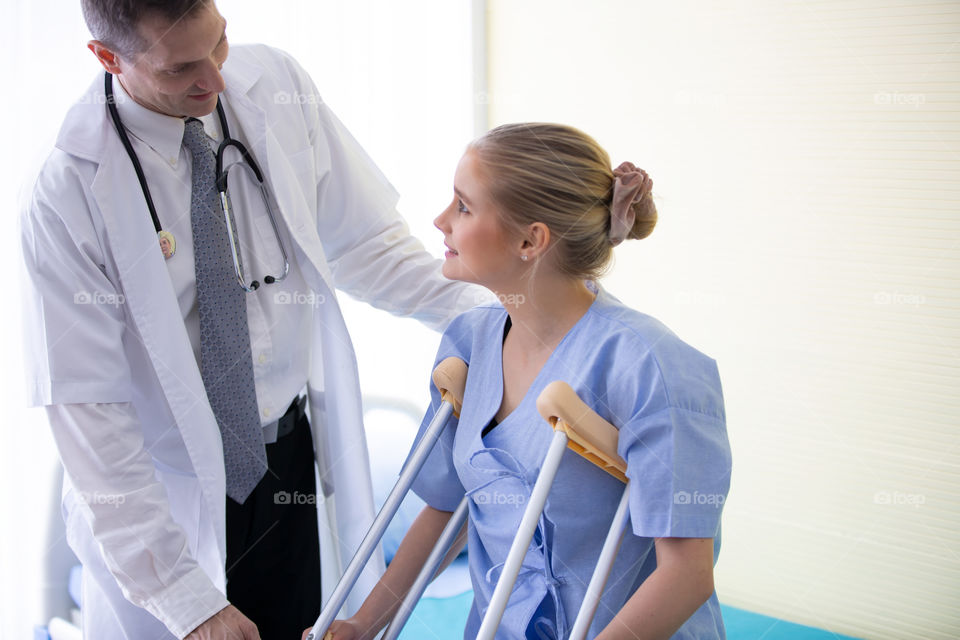 doctor explaining check up results to patient in hospital