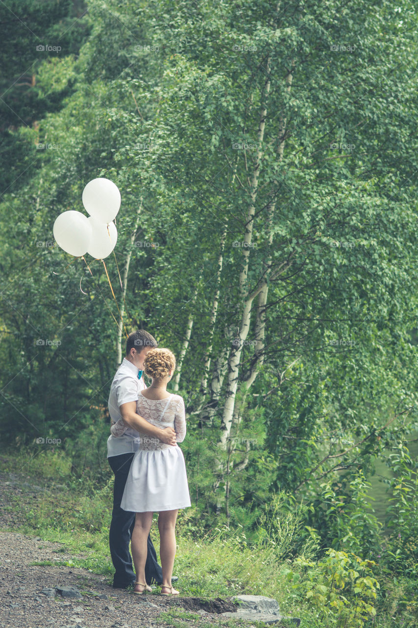 Just married are staying in a forest