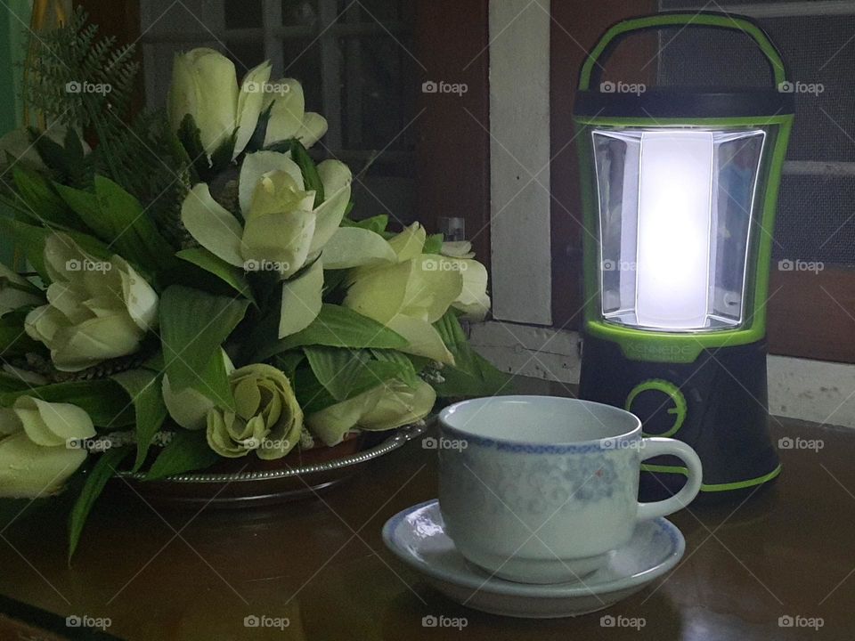 Lamp, light, flower, cup of tea at night