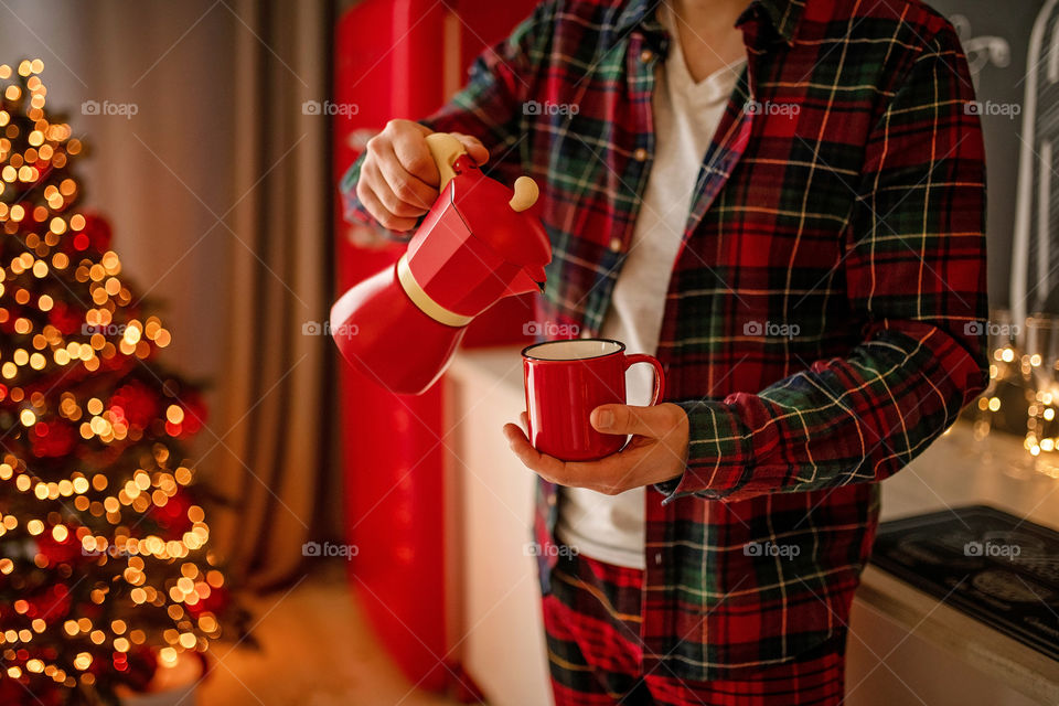 cup of coffee in a cozy festive Christmas atmosphere