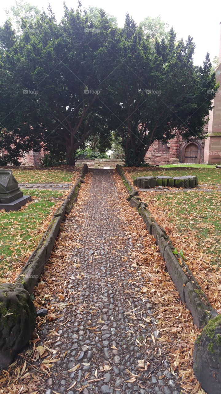 A pebble path in an old English cemetery