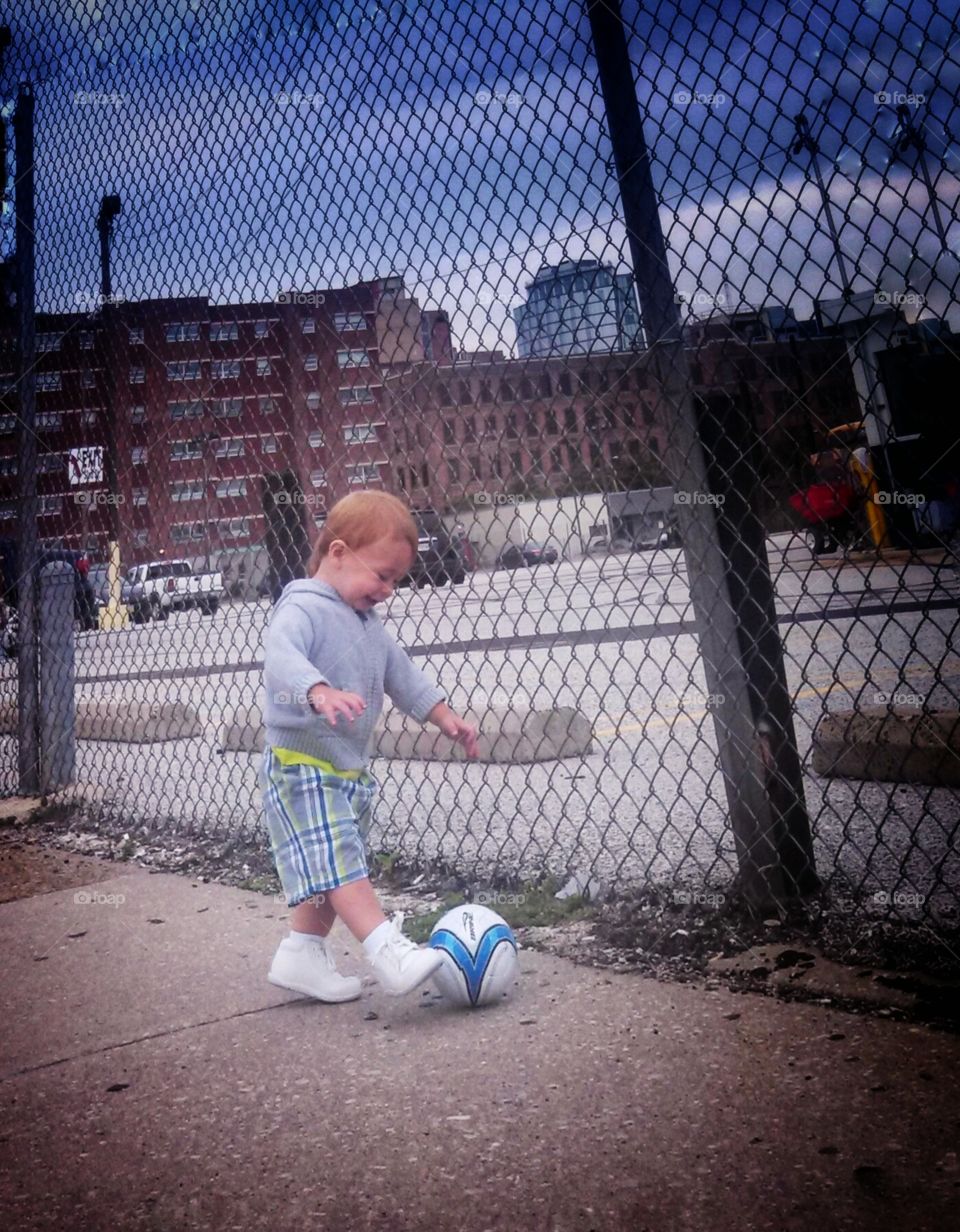 Futbol. My nephew and his first soccer ball