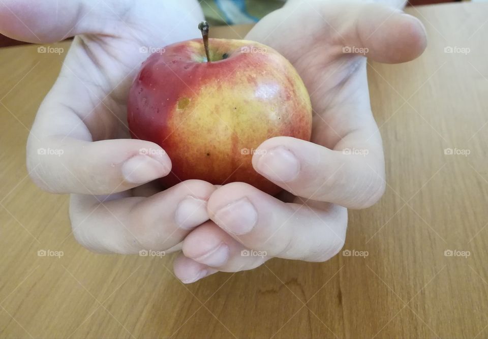 Apple in his hands