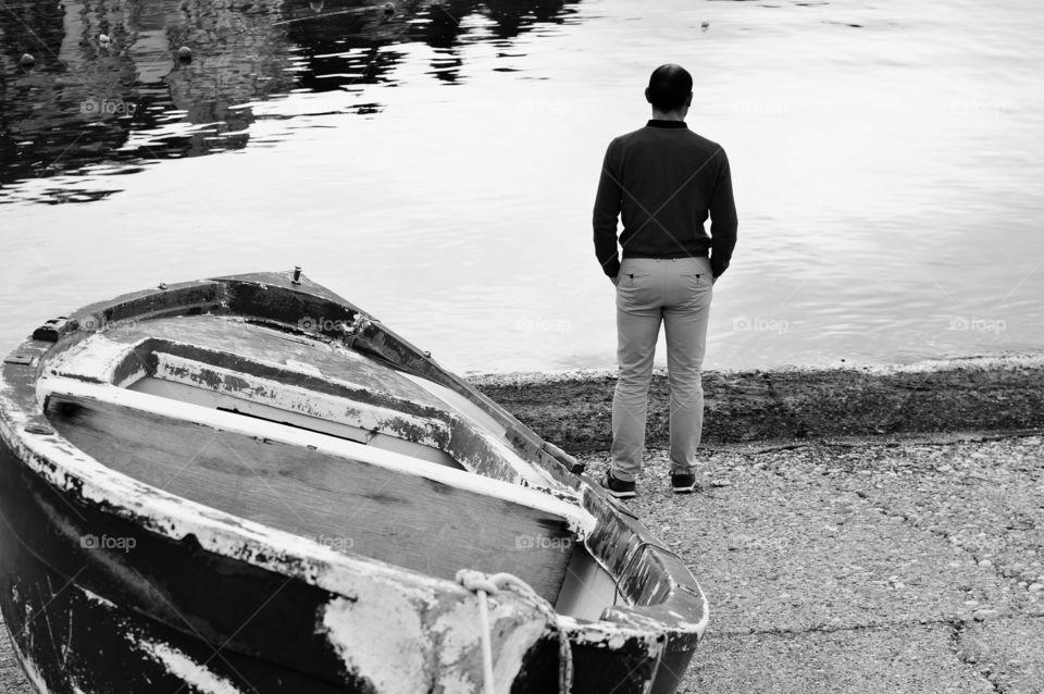 man from behind looking at the sea