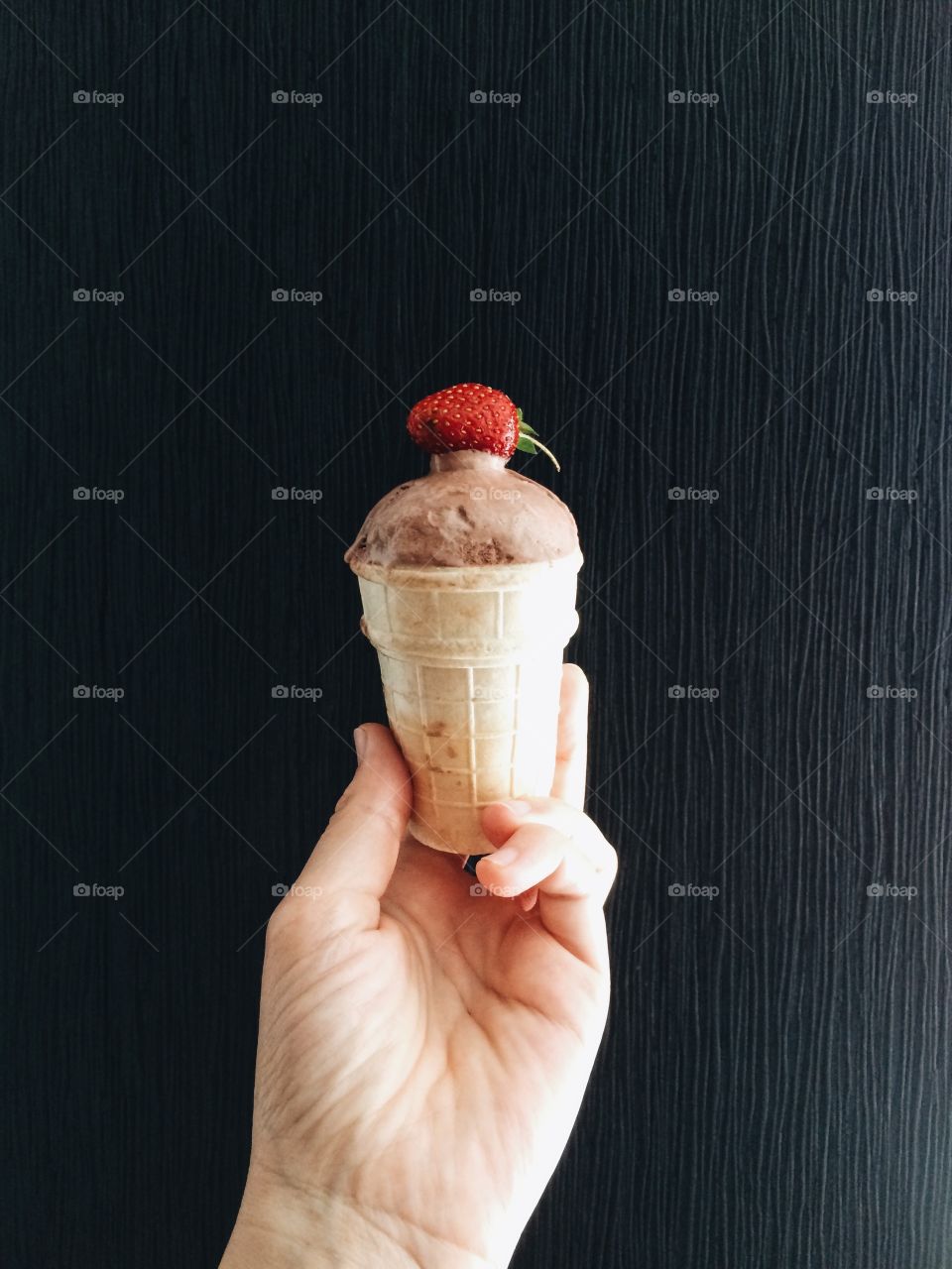 A person holding ice cream