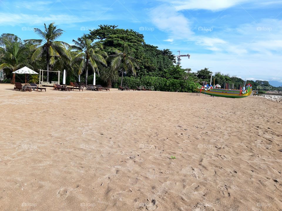 A view of seaside of Sanur Beach in a sunny day. This photo pictures the condition of toursim place in Bali during the pandemic of Covid-19