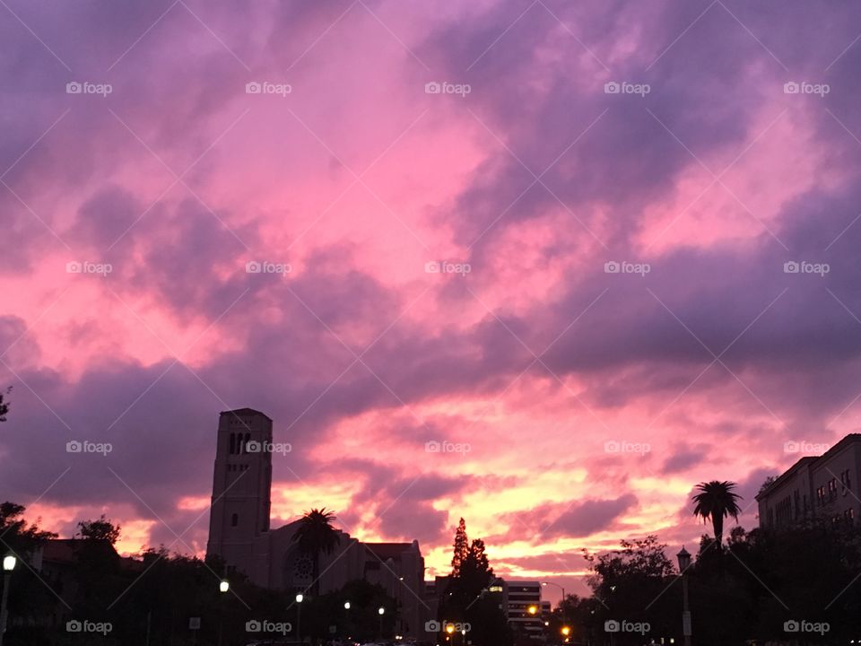 Purple sunset over a dark skyline 