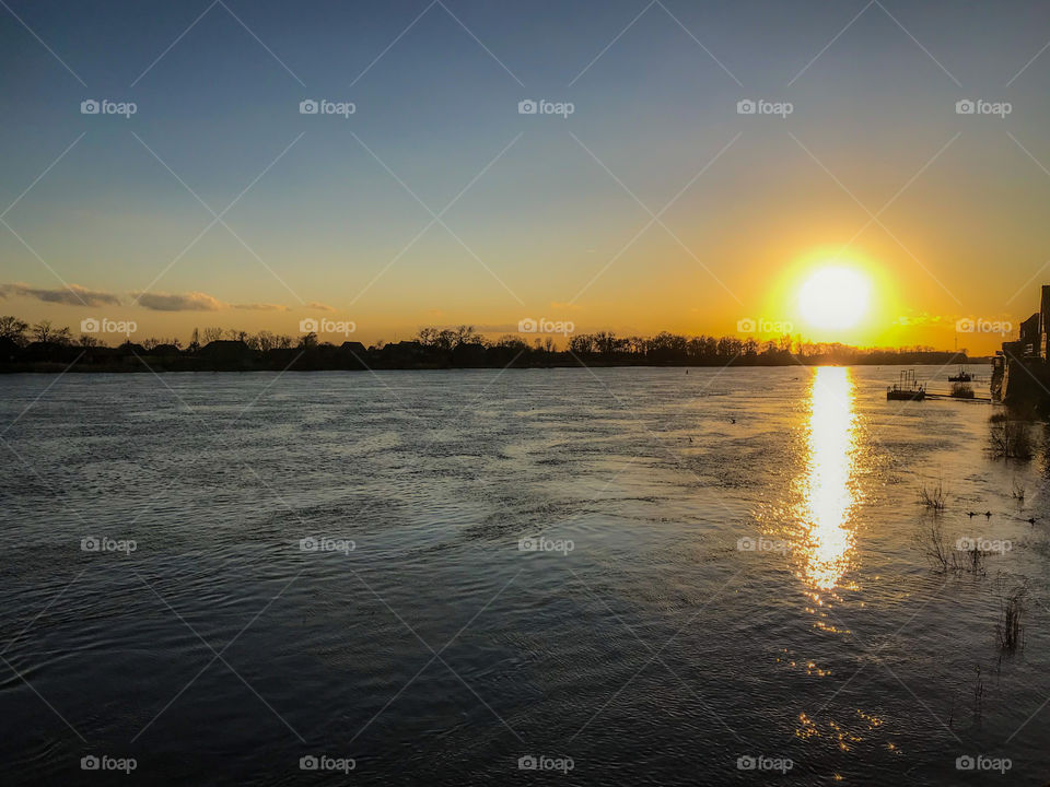 Sunset on the river in winter