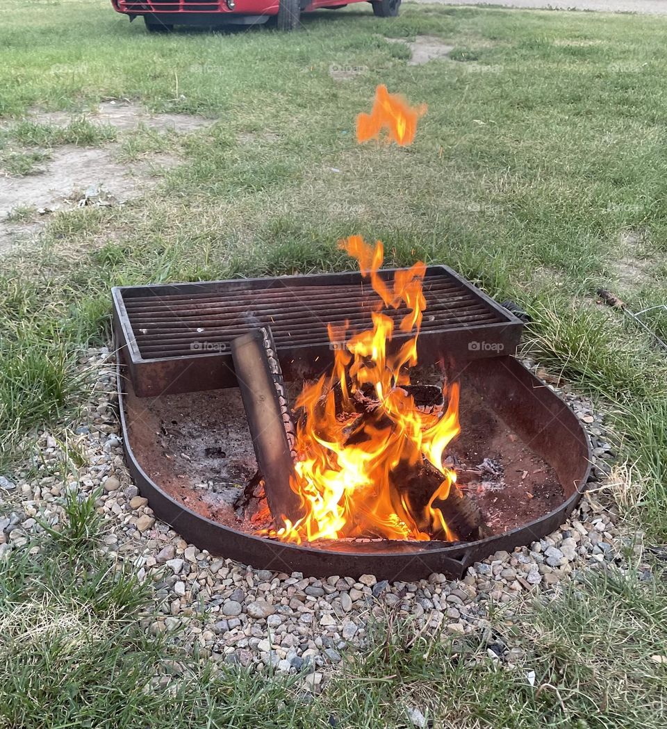 Daytime firepit, out camping, with a little upside down heart flame