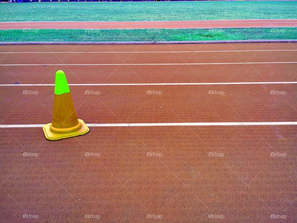 track and field oval and safety cone