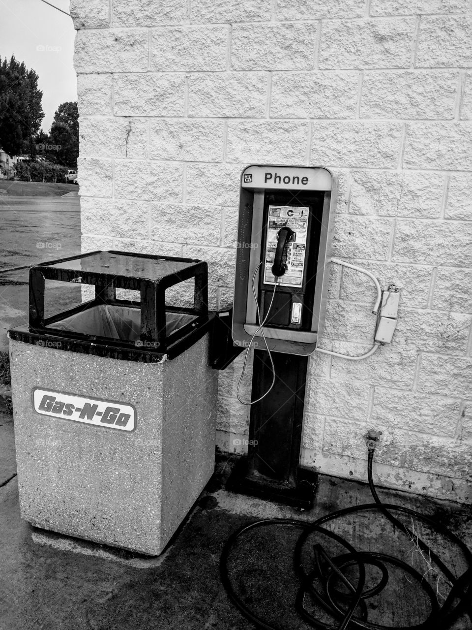 what the hell is a pay phone still doing at a gas station?